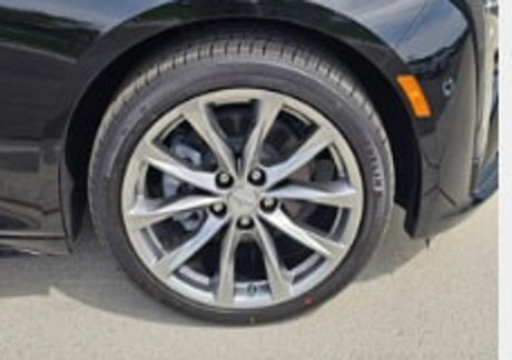 Close-up of a Cadillac CT5 alloy wheel and brake caliper