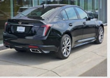 Black Cadillac CT5 photographed from the rear side angle